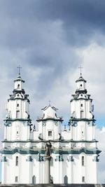 Low angle view of building against cloudy sky