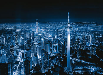 Aerial view of illuminated buildings in city at night