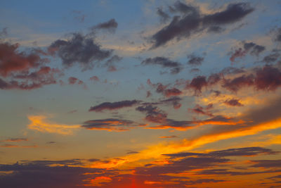 Low angle view of dramatic sky during sunset