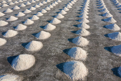 High angle view of pebbles on sand