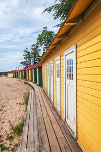 Colourful beach cabins at a sand beach