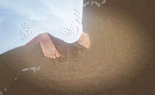 Low section of woman on beach