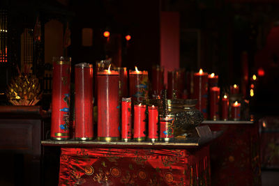 Illuminated candles in temple building