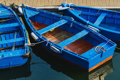 Boats moored at harbor