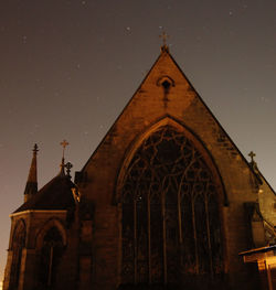 Low angle view of cathedral against sky at night