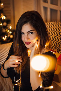 Portrait of a young woman drinking glasses