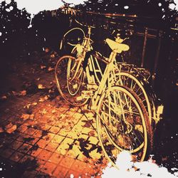 Bicycle parked by tree