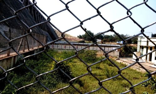 Close-up of chainlink fence against clear sky