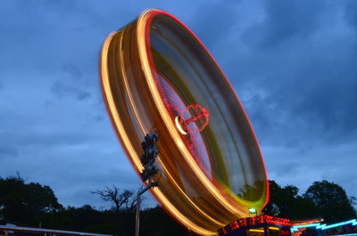 Low angle view of ferris wheel against sky