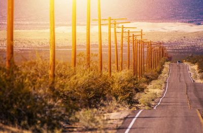 Road amidst landscape against sky