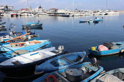 High angle view of fishing boats moored at harbor