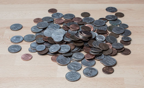 High angle view of coins on table