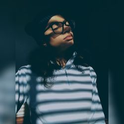 Portrait of young woman looking away