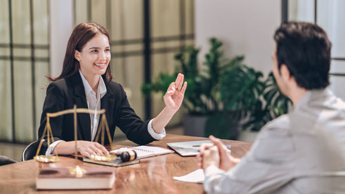 Smile female lawyer say don't worry with customers