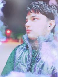 Portrait of young man looking away