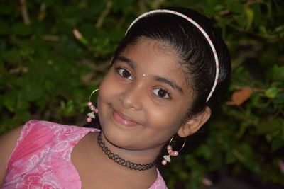 Close-up portrait of a smiling young woman