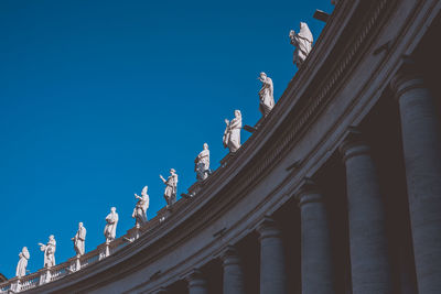 Low angle view of historic building against blue sky