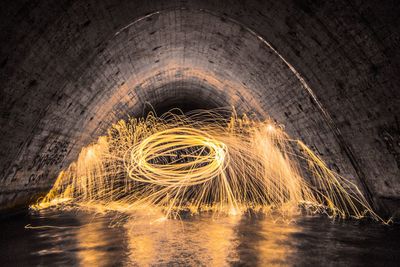 Light painting in water filled tunnel