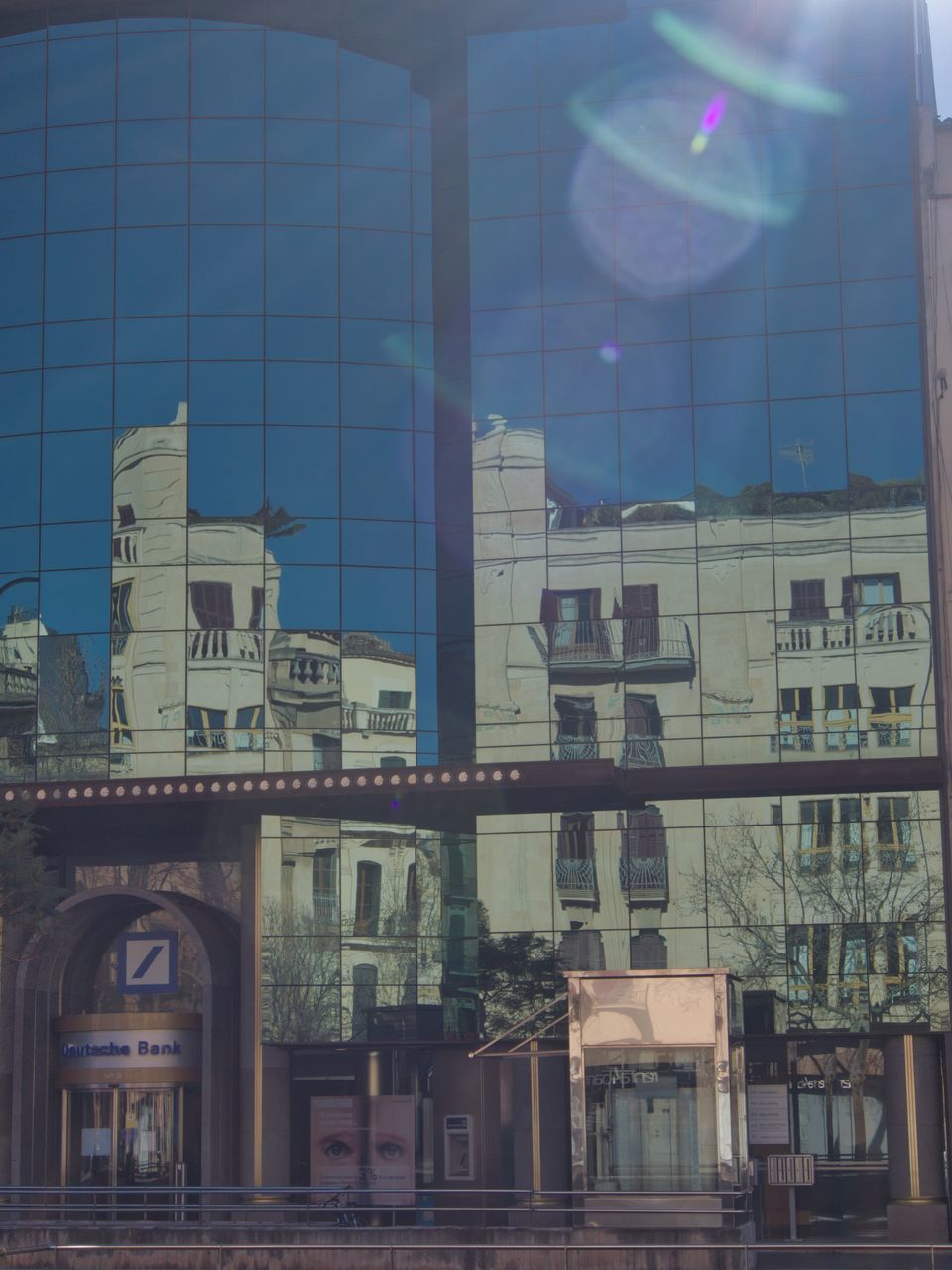 LOW ANGLE VIEW OF BUILDING AGAINST BLUE SKY