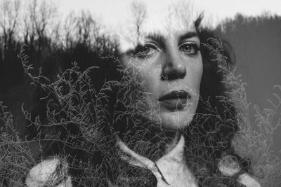 Double exposure of woman and plants