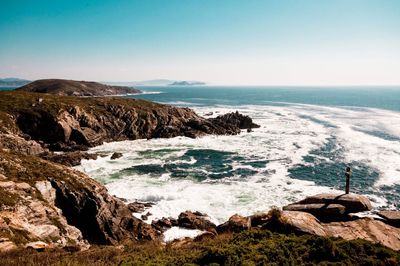 Scenic view of sea against clear blue sky