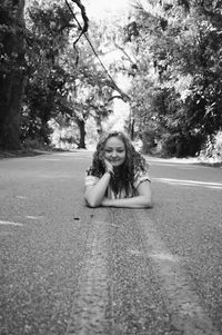 Portrait of a girl sitting on tree