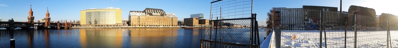 Panoramic view of buildings by oberbaum bridge on spree river