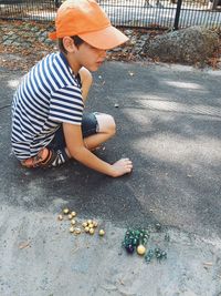 Boy playing with marbles