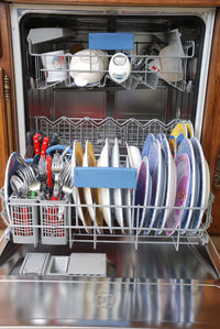 Close-up of dishwasher at home