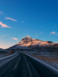 Empty road against sky