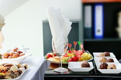 Dessert served in plates on table