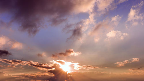 Low angle view of silhouette woman against sky during sunset