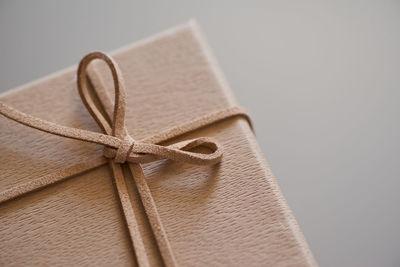 Close-up of gift box against gray background