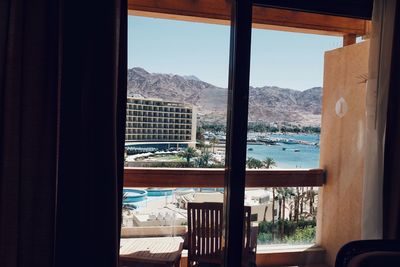 Buildings seen through glass window