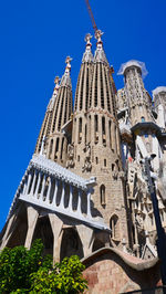 Low angle view of building against blue sky