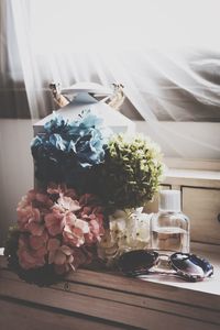 Close-up of flower vase on table at home