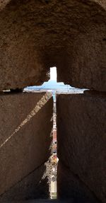 Cross on wall of building
