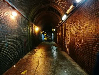 Man in illuminated tunnel