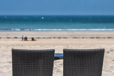 Close-up of beach against sky