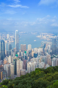 Aerial view of modern buildings in city against sky