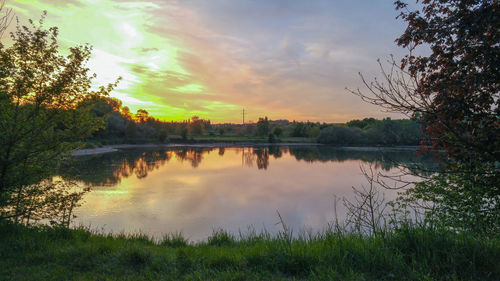 Scenic view of lake at sunset