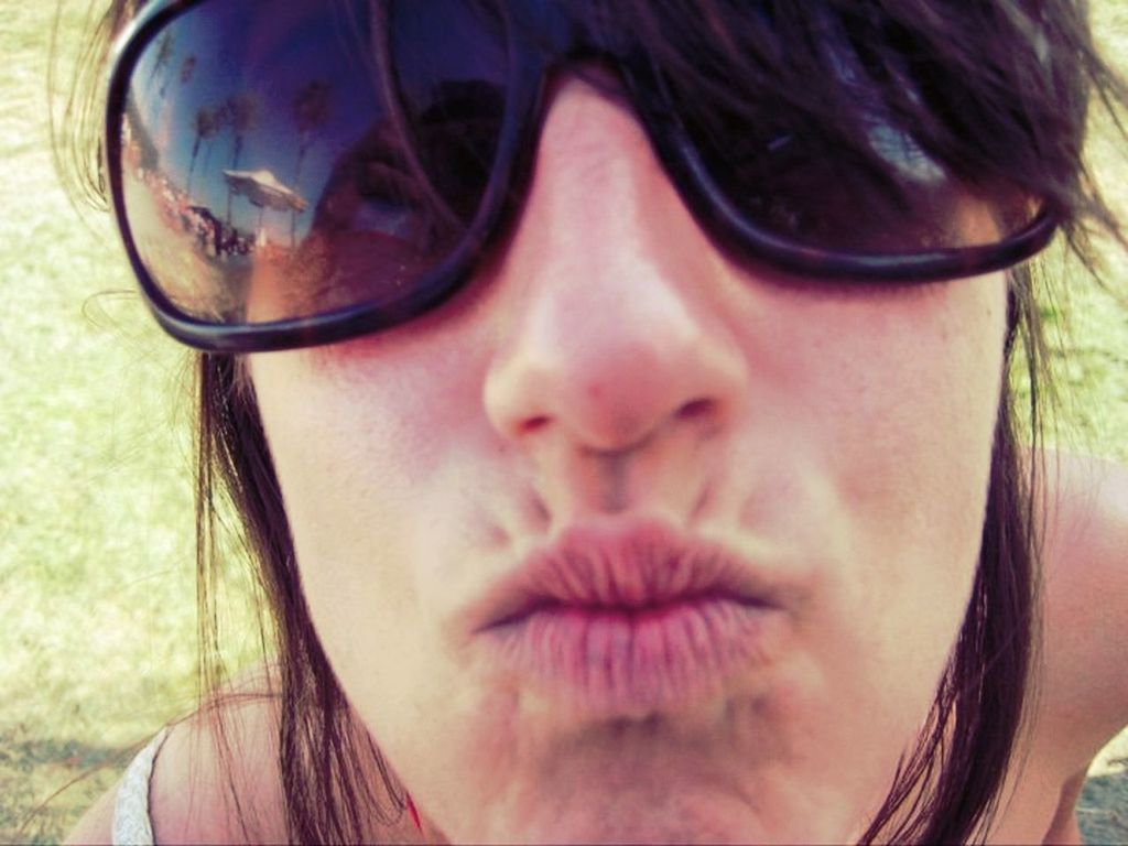 headshot, person, lifestyles, looking at camera, portrait, close-up, leisure activity, young adult, young women, front view, sunglasses, human face, head and shoulders, smiling, day, transportation, sunlight, focus on foreground