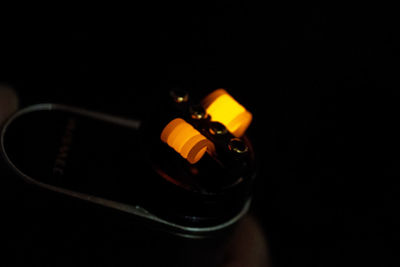 Close-up of vape pen in darkroom