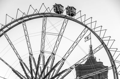 Low angle view of ferris wheel against sky