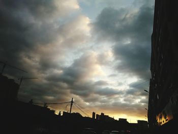 Low angle view of silhouette trees against sky at sunset