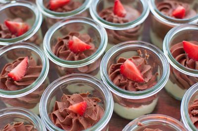 Full frame shot of sweet food in drinking glasses on table