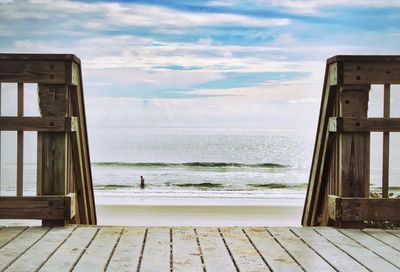 Scenic view of sea against cloudy sky