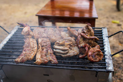 High angle view of meat on barbecue grill