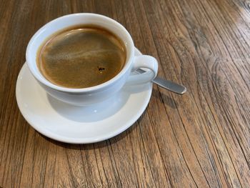 High angle view of coffee cup on table