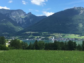 Scenic view of landscape and mountains against sky